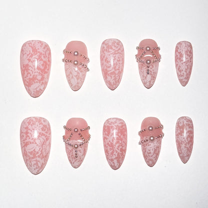 Set of pink nail art designs with decorative elements on a white background