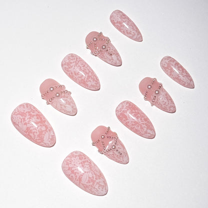 Set of pink nail art designs with decorative elements on a white background