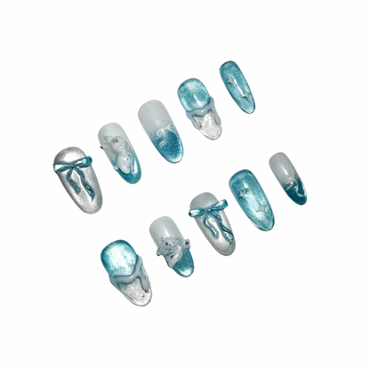 Set of blue and clear nail tips on a white background